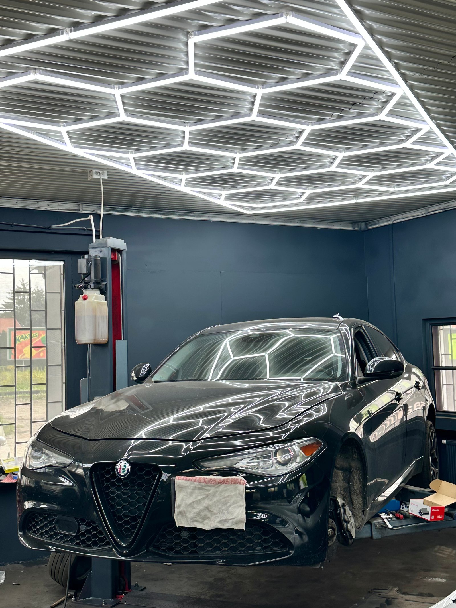 Black Alfa Romeo in the workshop